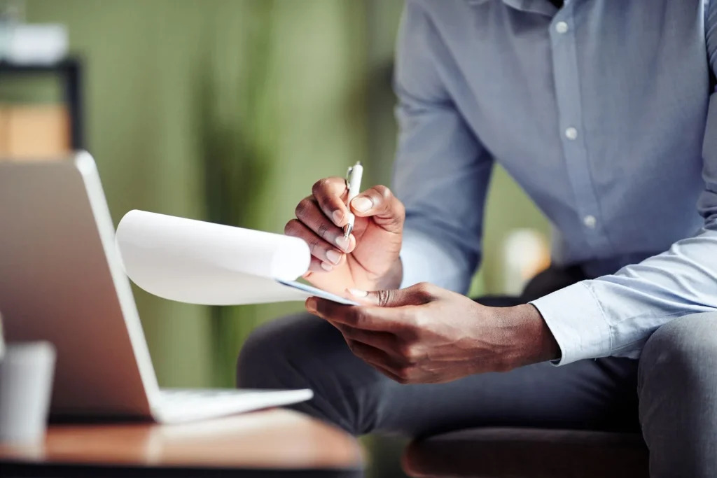 acd5af01845f4a2bb1583ea28e5904b4counselor-taking-notes-during-online-session-2022-05-01-23-00-32-utc-1920w-1024x683
