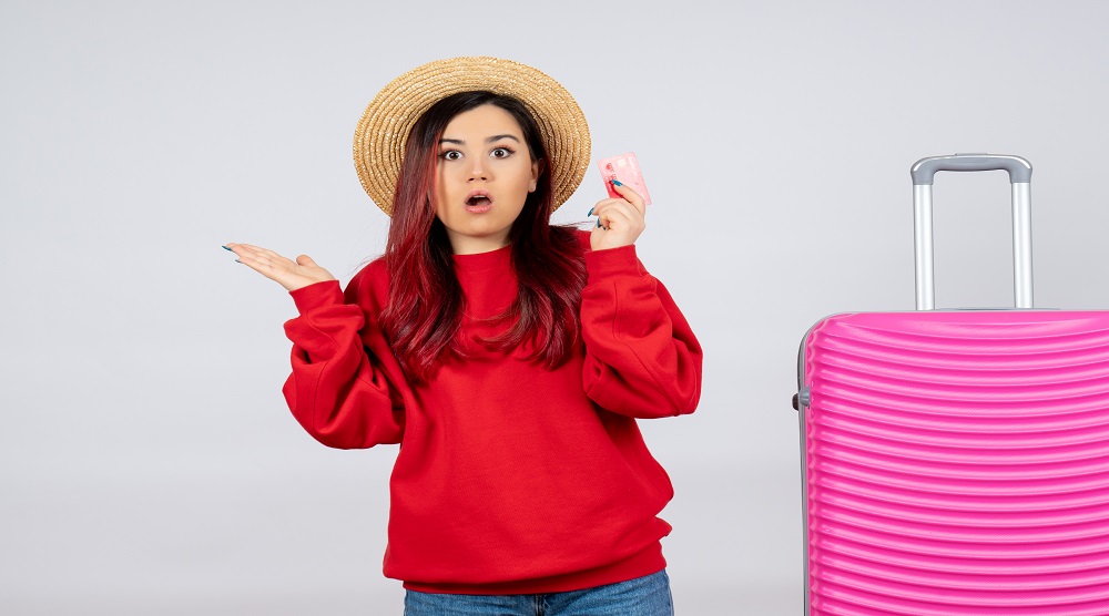 front-view-young-female-with-pink-bag-holding-bank-card-white-wall
