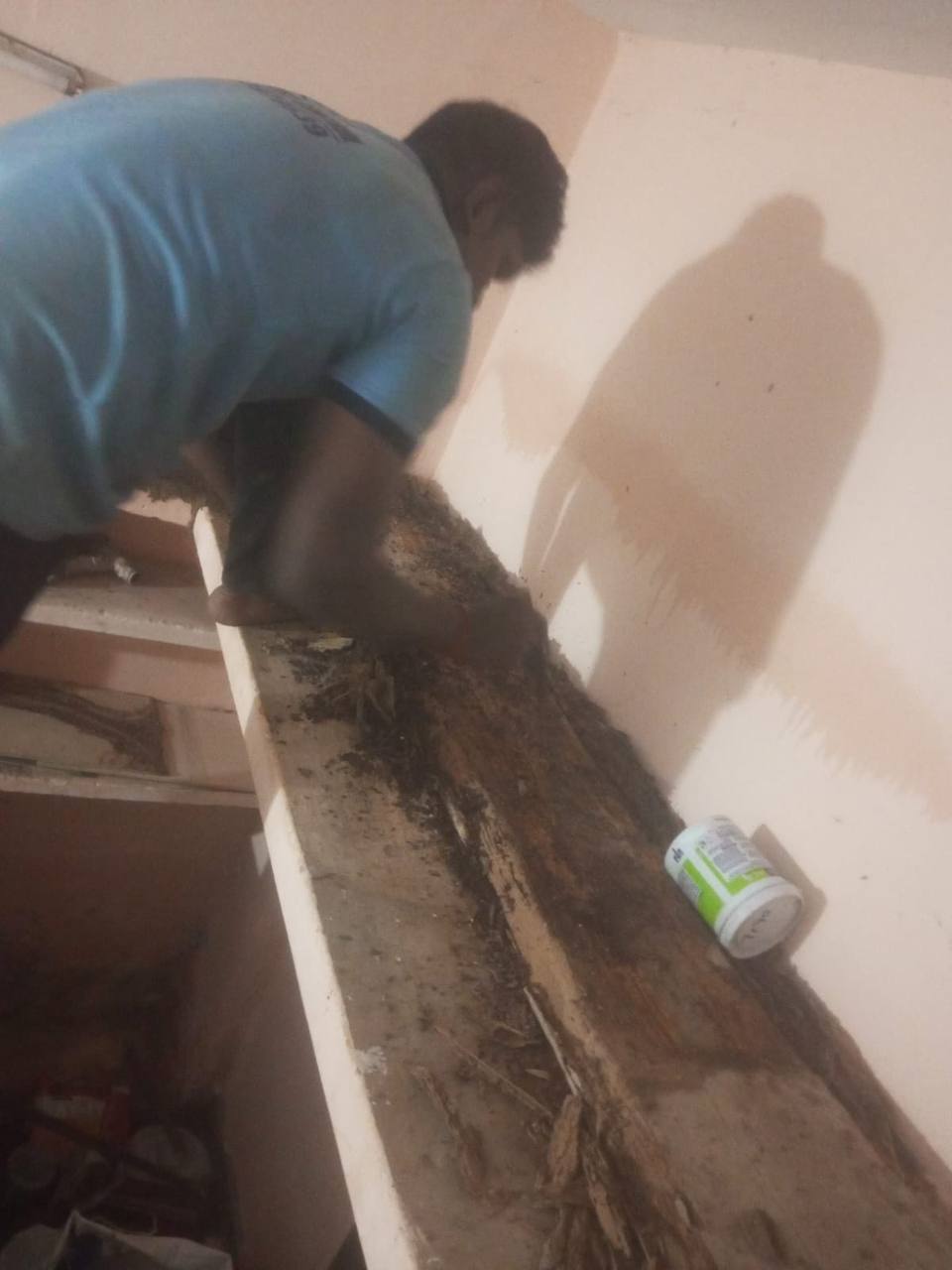 anti-termite-treatment-on-a-wooden-cabinet-and-wall-edge-in-Chennai